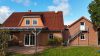Einfamilienhaus im Friesenstil mit großem Garten - Terrasse und Außentreppe ins DG Anbau
