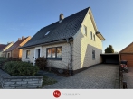 Wohnen mit Gartenidylle und vielen Optionen - H&T Immobilien - Einfamilienhaus in Stuhr