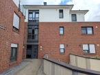 Wohnen mit Balkon im Herzen von Brinkum! - hintere Hausansicht