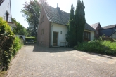 Einfamilienhaus mit Sanierungsbedarf auf großem Grundstück in ruhiger Lage von Weyhe-Leeste - Gartenansicht_2