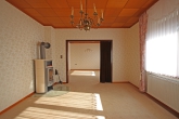 RESERVIERT! Viel Platz für Ihre Ideen: EFH mit großem Potenzial in ruhiger Randlage - Wohnzimmer, Kaminofen