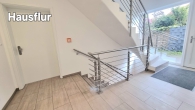 Moderne KfW-55 EG-Wohnung mit Terrasse & Carport - Hausflur