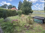 Gepflegtes Siedlungshaus mit Baugrundstück - pflegeleichter Garten