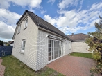 Traumhaft – Einfamilienhaus mit Garage und Südwest-Garten in Top-Lage! - rückwärtige Hausansicht